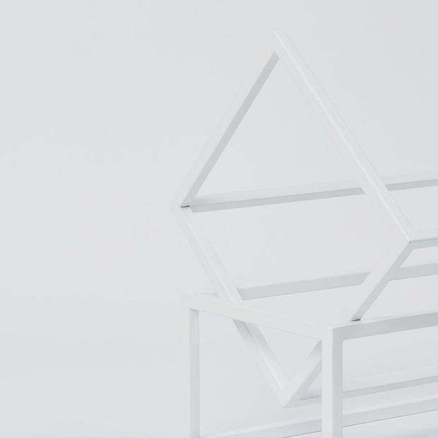 Elegant details from White Powder Coated Steel Book Keeper from Kristina Dam studio